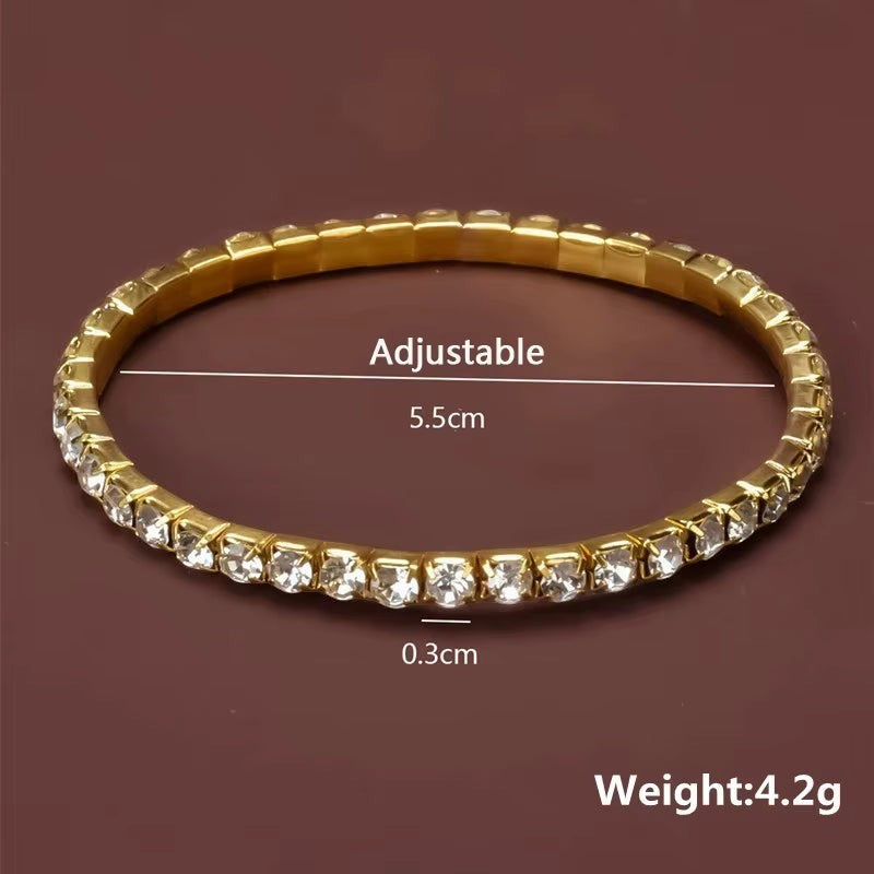 My Store elegant gold-tone tennis bracelet featuring a continuous row of sparkling crystals on a flexible band