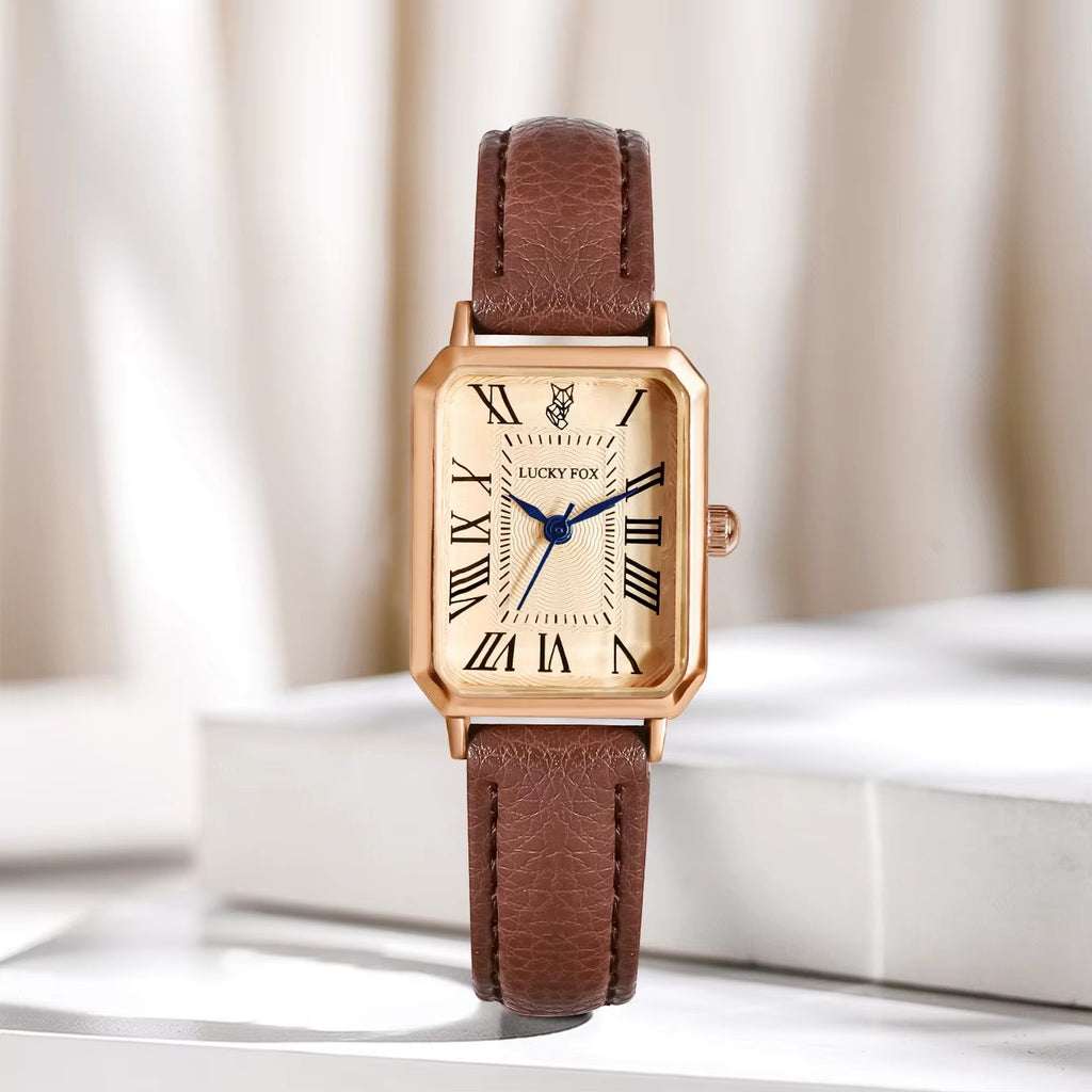 My Store LUCKY FOX rectangular rose gold watch with a cream dial, Roman numerals, and a brown textured leather strap.
