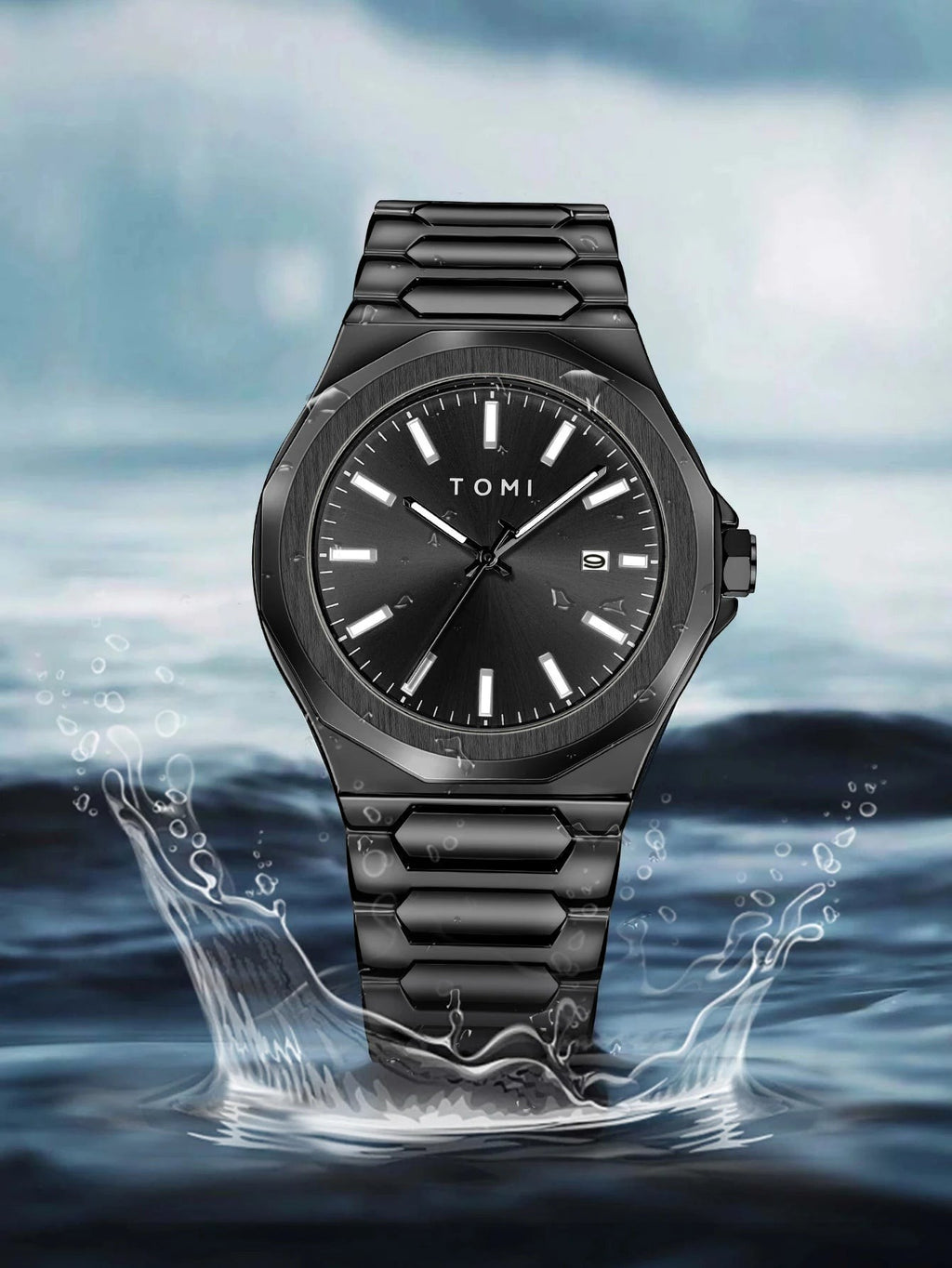 My Store TOMI luxury all-black stainless steel wristwatch with luminous markers, displayed over water splash effect.