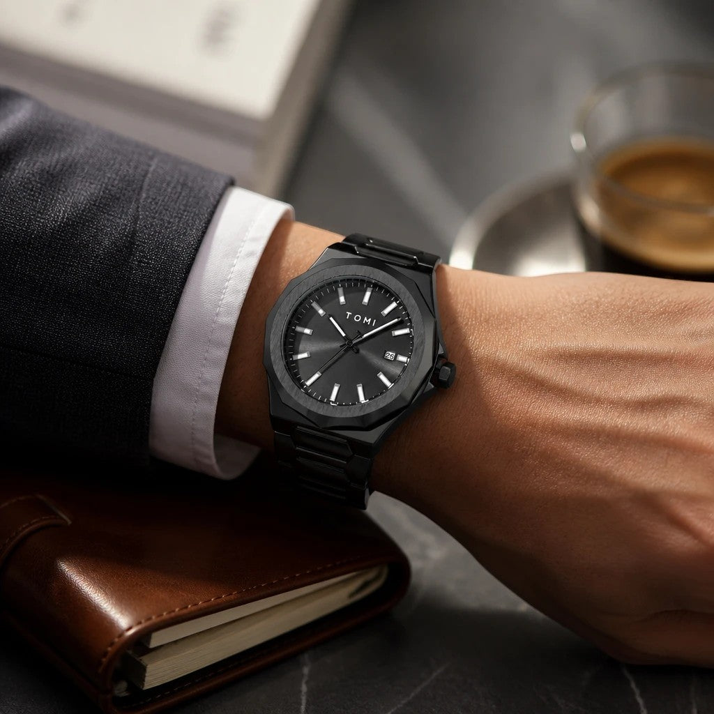 My Store TOMI luxury all-black stainless steel wristwatch with minimalist dial worn on a man's wrist