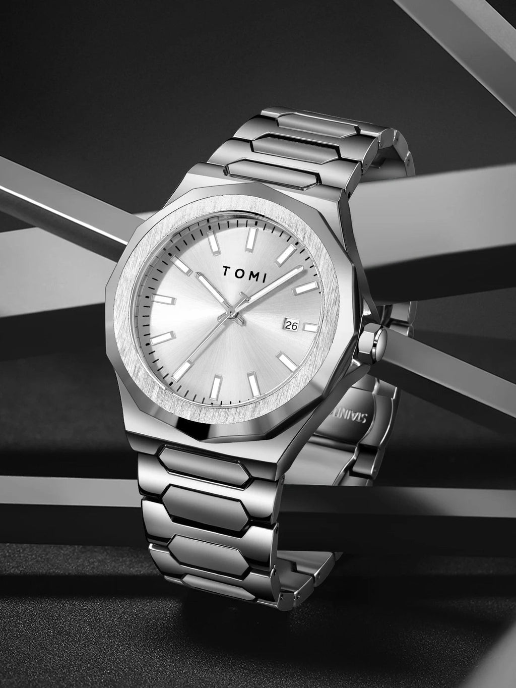 My Store TOMI luxury silver stainless steel wristwatch with a textured bezel, date window, and link bracelet.